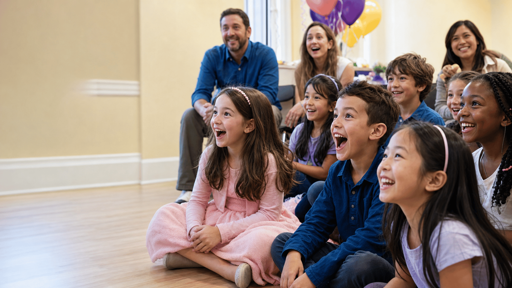 Children and families laughing as they watch a Party Troupe performance
