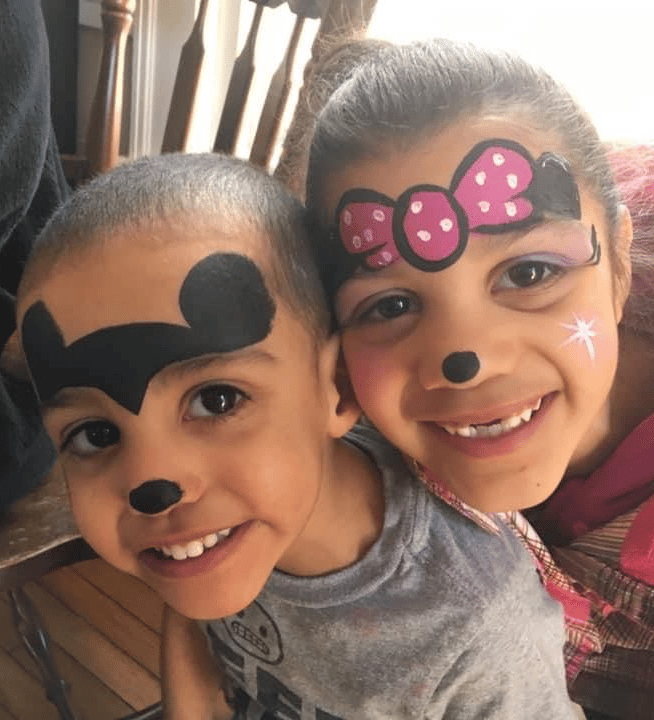 Children wearing playful mouse face paint
